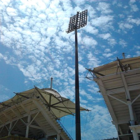 Stadium floodlight pylon against a cloudy sky